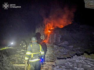 Firefighters put out the fire of a city hospital following a Russian attack in Sumy region, Ukraine, Tuesday, July 15